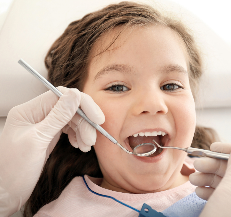 Child smiling during a gentle dental examination